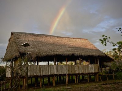 rainbow-thatched-roof-hut-amazon-brazil-rain-shower-sun-rainforest_t20_rokNmz-min